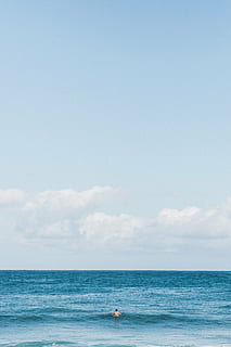 beach, blue, clouds, color, man, ocean, outdoors, person, recreation, sea, seascape, sky, summer, sun, swim, swimming, travel, turquoise, water, horizon over water, horizon, beauty in nature, scenics - nature, cloud - sky, copy space, tranquility, tranquil scene, day, land, real people, nature, waterfront, one person, non-urban scene, 2K, CC0, public domain, royalty free