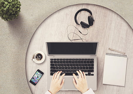 person, hand, grey, laptop computer, notepad, mobile phone, notebook, table, headphones, coffee, hands, tap, pen, plant, round table, about, wooden table, leaves, decoration, note, writing pad, business, leave, paper, online, computer, businessman, businesswoman, web, scene, coolie, message, letters, communication, letter traffic, correspondence, greetings, contact, blog, blogger, matt, connection, creative, lance, deco, planning, work from home, cafe, network, social network, work, white, brown, technology, wireless technology, human hand, one person, portable information device, human body part, laptop, directly above, smart phone, indoors, computer equipment, real people, high angle view, adult, using laptop, typing, keyboard, finger, 2K, CC0, public domain, royalty free