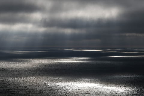 body, water, gray, cloudy, sky, sun rays, spotlights, cloud, ocean, sea, horizon, nature, cloud - Sky, dark, cloudscape, weather, storm, overcast, dramatic Sky, no People, scenics, backgrounds, moody Sky, outdoors, tranquility, reflection, scenics - nature, beauty in nature, environment, storm cloud, land, tranquil scene, horizon over water, landscape, rain, 5K, CC0, public domain, royalty free