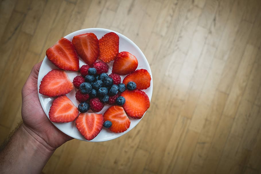 berries, snack, Healthy, blueberries, fruit, hands, raspberries, strawberries, top view, wood, strawberry, food, freshness, dessert, berry Fruit, red, sweet Food, summer, close-up, wood - Material, food And Drink, table, gourmet, ripe, healthy Eating, human hand, human body part, hand, wellbeing, one person, holding, real people, high angle view, indoors, personal perspective, raspberry, unrecognizable person, body part, finger, 5K
