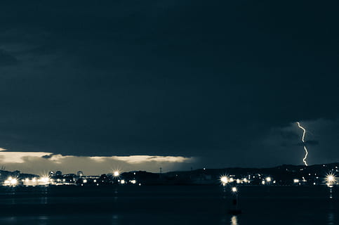 lightning, city lights, lightning during nighttime, lightning strike, nighttime, storm, dark, bolt, thunder, night, sky, cloud - Sky, weather, illuminated, smoke - physical structure, industry, built structure, power in nature, no people, beauty in nature, architecture, nature, power, thunderstorm, copy space, water, city, storm cloud, outdoors, cityscape, light, ominous, 2K, CC0, public domain, royalty free
