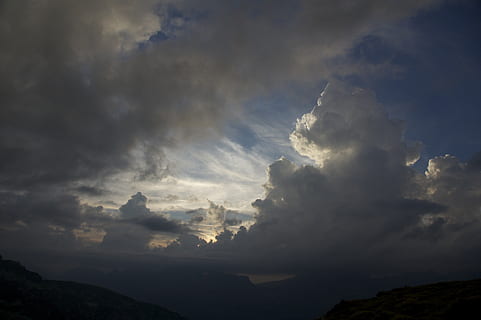 clouds, thunderstorm, evening, cloud - sky, sky, beauty in nature, scenics - nature, tranquil scene, tranquility, mountain, nature, no people, silhouette, non-urban scene, sunbeam, idyllic, outdoors, back lit, storm, sunlight, low angle view, dramatic sky, ominous, streaming, 1080P, CC0, public domain, royalty free