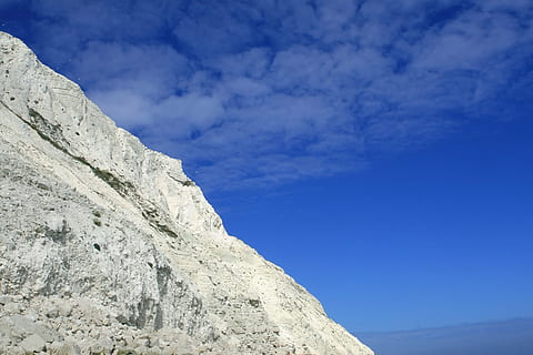 beach, beachy, beachyhead, blue, britain, british, chalk, cliff, coast, coastal, coastline, death, depressed, die, dover, england, english, geology, head, heritage, holiday, jump, jurassic, kill, landmark, landscape, nature, pebble, rock, rocky, seashore, seaside, self, shingle, shore, sky, steep, stone, suicide, summer, tourism, travel, vacation, white, cloud - sky, mountain, solid, environment, rock - object, beauty in nature, scenics - nature, mountain range, day, low angle view, extreme terrain, rock formation, no people, tranquility, outdoors, mountain peak, eroded, 2K, CC0, public domain, royalty free