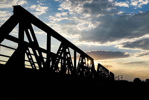 architecture, bridge, city, clouds, construction, dark, dawn, daylight, dusk, industry, iron, light, outdoors, silhouette, sky, steel, sun, Sun Rays, sunset, travel, water, cloud - sky, built structure, nature, low angle view, bridge - man made structure, no people, connection, transportation, scenics - nature, sunlight, beauty in nature, railing, metal, 4K, CC0, public domain, royalty free