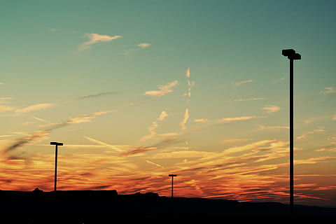 silhouette, light posts, post, cloudy, sky, sunset, lamp posts, dusk, clouds, street light, no people, cloud - sky, outdoors, nature, beauty in nature, scenics, street, orange color, scenics - nature, lighting equipment, low angle view, tranquil scene, tranquility, pole, floodlight, dramatic sky, idyllic, 4K, CC0, public domain, royalty free