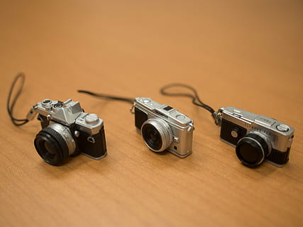 camera, model, strap, olympus, indoors, photography themes, wood - material, studio shot, technology, no people, camera - photographic equipment, retro styled, arts culture and entertainment, copy space, antique, table, close-up, brown, colored background, communication, group of objects, security, medium group of objects, silver colored, 4K, CC0, public domain, royalty free