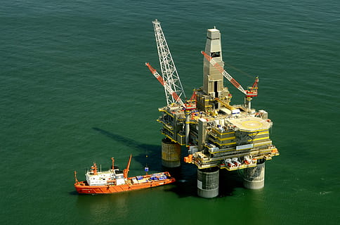 orange, cargo ship, beside, dock, russia, oil platform, rig, boat, ship, sea, ocean, water, drilling platform, structure, architecture, nature, outside, energy, fuel and power generation, industry, oil industry, fossil fuel, offshore platform, transportation, nautical vessel, high angle view, drilling rig, day, outdoors, no people, oil, business, waterfront, sunlight, 2K, CC0, public domain, royalty free