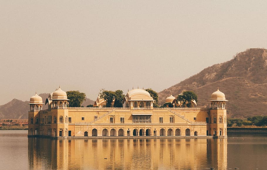 square, brown, structure, middle, water, photography, concrete, building, surrounded, body, palace, reflection, india, built structure, architecture, building exterior, travel destinations, nature, history, the past, travel, no people, sky, place of worship, lake, day, tree, outdoors, architectural column, ancient civilization, 4K