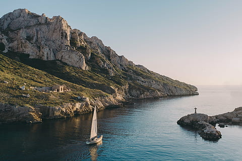 person, rock, white, boat, mountain, sailboat, sea, gray, sky, near, nature, landscape, mountains, slope, rocks, coast, sail, ruins, clouds, horizon, rock - object, water, scenics, no people, outdoors, travel destinations, day, beauty in nature, solid, scenics - nature, tranquility, land, tranquil scene, cliff, rock formation, non-urban scene, beach, rocky coastline, 4K, CC0, public domain, royalty free
