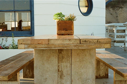 wood, bench, table, flowerpot, seat, wood - material, no people, day, architecture, outdoors, nature, built structure, plant, building exterior, absence, wall - building feature, art and craft, geometric shape, restaurant, shape, circle, modern, 2K, CC0, public domain, royalty free