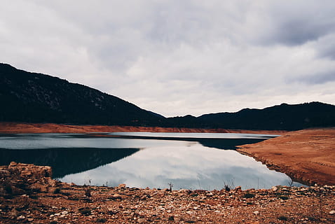 clouds, lake, landscape, mountain, nature, outdoors, reflection, silhouette, sky, water, scenics, tranquil scene, tranquility, scenics - nature, beauty in nature, cloud - sky, no people, mountain range, non-urban scene, environment, day, beach, idyllic, lagoon, 2K, CC0, public domain, royalty free