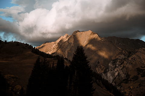 cloudy, dark clouds, landscape, mountain, mountain peak, nature, outdoors, rocky mountain, scenic, cloud - sky, sky, scenics - nature, beauty in nature, environment, mountain range, land, tree, plant, no people, tranquility, tranquil scene, non-urban scene, overcast, remote, pine tree, coniferous tree, ominous, formation, 5K, CC0, public domain, royalty free