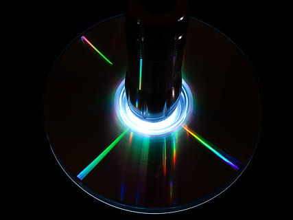 cd, dvd, digital, computer, silver, floppy disk, technology, black background, illuminated, geometric shape, shape, glowing, neon, multi colored, circle, lighting equipment, indoors, black color, motion, light - natural phenomenon, blue, studio shot, abstract, long exposure, electricity, night, 2K, CC0, public domain, royalty free