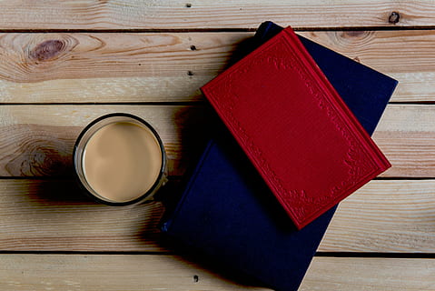 red, book, top, blue, beside, cup, desk, table, notebooks, planner, glass, coffee, wood - material, still life, no people, indoors, publication, food and drink, directly above, high angle view, drink, group of objects, refreshment, wood, container, close-up, shape, old, brown, leather, personal accessory, wood grain, hardcover book, 720P, CC0, public domain, royalty free