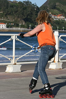 inline, dynamic, skating, skate, roller, summer, sea, orange, one person, water, real people, rear view, casual clothing, transportation, day, leisure activity, full length, lifestyles, nature, mode of transportation, sunlight, nautical vessel, architecture, women, standing, outdoors, jeans, hairstyle, human arm, 2K, CC0, public domain, royalty free