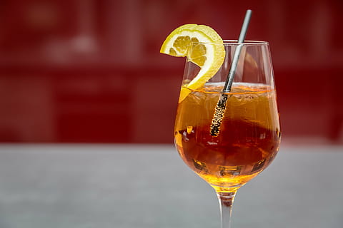 selective, focus photography, wine glass, wine, glass, drink, straw, lemon, wedge, alcohol, cocktail, beverage, drinking glass, food and drink, refreshment, red, drinking straw, close-up, focus on foreground, fruit, citrus fruit, household equipment, food, healthy eating, cold temperature, no people, orange color, freshness, ice cube, nightlife, orange, aperitif, drinking, 5K, CC0, public domain, royalty free
