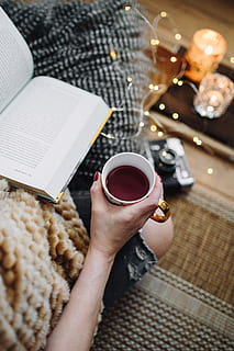 woman drinking tea, reading book, Woman, drinking, tea, female, home, book, reading, time, pillows, comfortable, cozy, hygge, fruit tea, fairy lights, coffee - Drink, cup, women, drink, human Hand, lifestyles, one Person, people, table, cafe, holding, coffee Cup, close-up, adults only, one woman only, food and drink, hand, real people, coffee, mug, refreshment, adult, high angle view, personal perspective, human body part, hot drink, finger, 4K