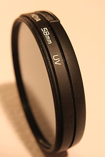 aparat fotograficzny, kanon, dslr, filtr, hmc, hoya, ultrafioletowy, przedmioty, technologia, czarny kolor, pojedynczy obiekt, stół, żadnych ludzi, studio strzał, branża elektroniczna, zbliżenie, wewnątrz, martwa natura, sprzęt fotograficzny, tematy fotograficzne, porozumiewanie się, skupić się na pierwszym planie, numer, tekst, aparat fotograficzny - sprzęt fotograficzny, obiektyw - instrument optyczny, selektywne skupienie, naciśnij przycisk, sprzęt, aparat cyfrowy, akcesoria osobiste, Skórzany, sprzęt elektryczny, 2K, CC0, domena publiczna, darmowe zdjęcia