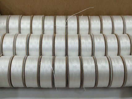bobbin, sewing, thread, indoors, business, metal, factory, technology, in a row, industry, close-up, large group of objects, no people, occupation, equipment, order, pattern, abundance, repetition, manufacturing, textile, hanging, food and drink, silver colored, quality control, 4K, CC0, public domain, royalty free