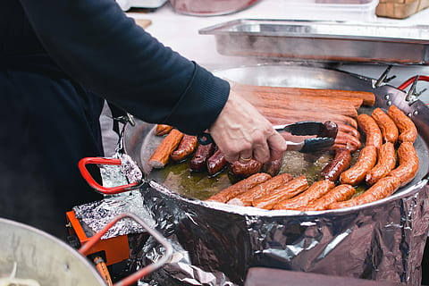 market, Sausages, cooking, hands, meat, sausage, food, barbecue Grill, outdoors, barbecue, men, people, grilled, human hand, preparation, human body part, one person, one man only, food and drink, freshness, preparing food, holding, midsection, real people, occupation, hand, day, seafood, small business, high angle view, working, chef, fish market, 5K