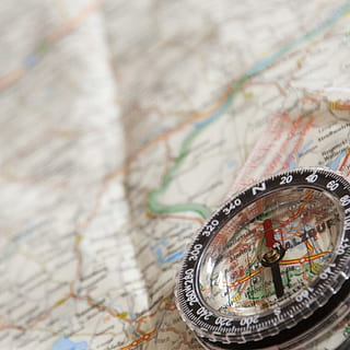 round, black, compass, map, navigation, north, navigation device, guidance, direction, travel, world map, exploration, close-up, no people, travel destinations, selective focus, navigational compass, text, adventure, discovery, tourism, high angle view, communication, outdoors, searching, 1080P, CC0, public domain, royalty free