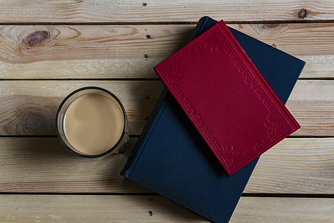beverage, blank, board, books, coffee, cup, cup of coffee, design, desk, drink, education, table, wood, wooden, wood - material, still life, indoors, no people, high angle view, directly above, publication, book, food and drink, red, container, shape, close-up, refreshment, group of objects, medium group of objects, food, leather, 5K, CC0, public domain, royalty free