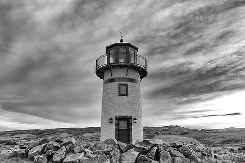 grayscale photo, lighthouse, grayscale, photo, concrete, grey, sky, clouds, door, rocks, safety, guidance, cloud - sky, protection, direction, building exterior, tower, beach, architecture, built structure, building, security, nature, low angle view, outdoors, no people, day, water, sea, 720P