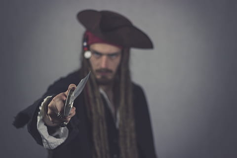 jack sparrow, pirate, knife, captain, mutiny, seafaring, corsair, pirates, piracy, adventure, privateers, portrait, evil, grim, angry, male, upset, person, human, robbery, thief, man, predator, rob, criminal, guy, dressed up, offender, robber, theft, risk, steal, crime, threatening, threat, hunting knives, dreadlocks, dreads, hair, bart, pirate costume, costume, outlaw, coseplay, halloween, dark, raid, seafarer, attack, one person, hat, clothing, weapon, young adult, holding, looking at camera, headshot, gun, lifestyles, real people, handgun, studio shot, indoors, young men, adult, social issues, aggression, 5K, CC0, public domain, royalty free