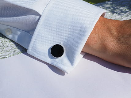 round, black, cuff link, button, cufflink, cuff, closure, business dress, man, suit, business, ripe, serious, healthcare And Medicine, human hand, human body part, hand, one person, indoors, high angle view, close-up, real people, white color, men, day, paper, holding, table, working, rolled up, body part, nature, finger, 4K, CC0, public domain, royalty free