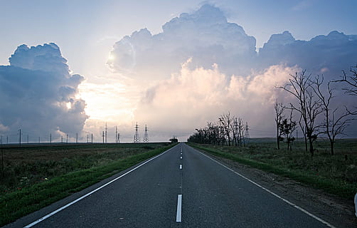 concrete, road, leading, grass field, blue, clouds, light, sky, sun, sunset, travel, trees, outdoor, way, highway, trip, horizon, dom, summer, journey, countryside, country, asphalt, view, landscape, nature, transportation, environment, cloud - sky, direction, the way forward, sign, plant, land, symbol, grass, rural scene, tree, road marking, no people, diminishing perspective, outdoors, 1080P, CC0, public domain, royalty free