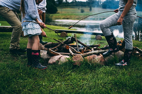 family camping, body, water, daytime, group, people, front, bonfire, group of people, body of water, outdoors, men, nature, grass, working, adult, low section, adults only, human leg, real people, two people, day, casual clothing, lifestyles, plant, leisure activity, land, field, standing, food, 5K, CC0, public domain, royalty free