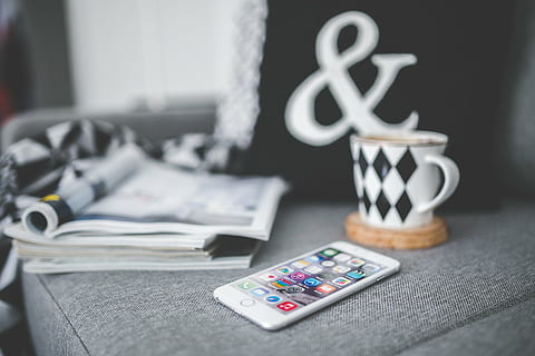 iphone, white, black, mug, book, mobile, tech, technology, iphone 6, iphone 6 plus, apple, touchscreen, phone, device, work, rest, couch, cup, coffee, home, home decor, decor, interior, screen, screentouch, magazine, magazines, finance, currency, business, no people, indoors, close-up, furniture, remote control, table, stack, selective focus, focus on foreground, still life, textile, control, remote, day, relaxation, group of objects, dollar sign, blister pack, 4K, CC0, public domain, royalty free