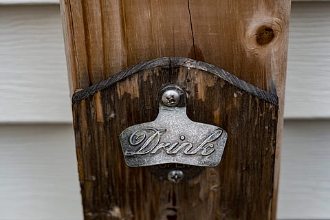 still, items, things, bottle, opener, wood, panel, decorative, functional, wood - material, no people, close-up, focus on foreground, metal, door, day, entrance, protection, safety, security, pattern, outdoors, door knocker, old, brown, closed, knob, art and craft, carving - craft product, wooden post, ornate, floral pattern, 4K, CC0, public domain, royalty free