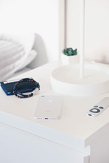 beaded, black, brown, bracelets, beside, white, iphone, table, silver iphone 7, silver apple tv, remote, wooden, nightstand, bedside table, interior design, interior, bedside, minimalist, minimalism, design, essential, simple, style, succulent, phone, remote controll, bracelet, indoors, no people, still life, white color, publication, group of objects, book, furniture, paper, close-up, pen, technology, absence, container, domestic room, office, medium group of objects, focus on foreground, mirror, personal accessory, 4K, CC0, public domain, royalty free