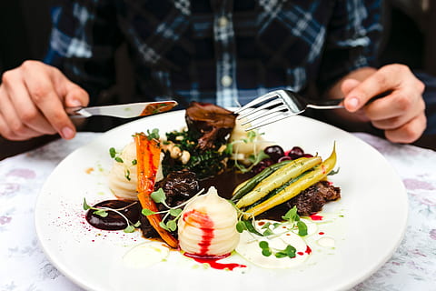 dinnaer at restaurant, restaurant, food, eating, meal, dinner, eat, hungry, beef, meat, plate, vegetable, human Hand, people, healthy Eating, gourmet, food And Drink, close-up, freshness, salad, lunch, tomato, caucasian Ethnicity, crockery, one man only, one person, ready-to-eat, midsection, wellbeing, hand, indoors, real people, focus on foreground, table, seafood, holding, human body part, garnish, temptation, finger, table knife, 4K