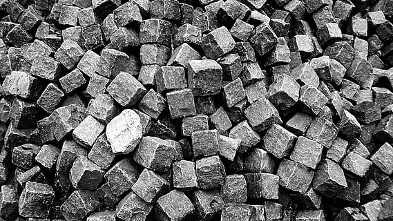 grayscale photography, rocks, brick, stone, blocks, building material, construction, solid, black-and-white photography, bw, backgrounds, pattern, abstract, full frame, abundance, large group of objects, textured, stack, no people, day, sunlight, design, repetition, shape, high angle view, still life, outdoors, close-up, nature, rough, construction site, concrete, 5K, CC0, public domain, royalty free