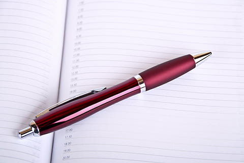 red, retractable, pen, ruled, paper, time, plan, office, note, appointment, schedule, leave, calendar, schedule plan, planning, fountain pen, writing, note pad, diary, close-up, no people, education, writing instrument, publication, book, still life, page, indoors, open, high angle view, two objects, table, ballpoint pen, white color, blank, 2K, CC0, public domain, royalty free