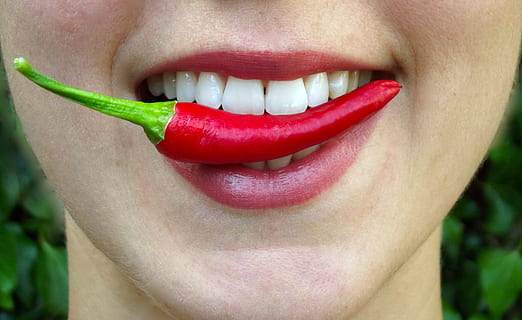person, biting, red, chili, chilli, bite, hot, lips, mouth, eat, spicy, fresh, healthy, food, girl, delicious, pepper, woman, vegetable, snack, mexican, chillies, human body part, human mouth, close-up, human lips, one person, lipstick, body part, teeth, adult, women, toothy smile, make-up, human teeth, smiling, emotion, young adult, happiness, human face, positive emotion, beautiful woman, mouth open, 2K, CC0, public domain, royalty free