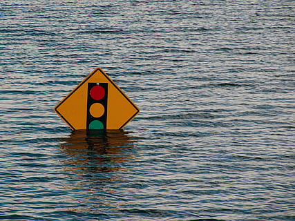 yellow, road signage, surrounded, body, water, sign, stoplight, board, red, green, warning Sign, no people, communication, sea, safety, nature, day, waterfront, outdoors, protection, rippled, single object, security, tranquility, accidents and disasters, floating on water, warning symbol, 720P