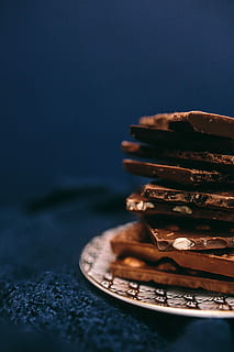 close, nut chocolate bar, Close up, nut, chocolate bar, sweet, candy, chocolate, dark, dessert, food, sweet Food, close-up, gourmet, snack, brown, food and drink, stack, indoors, no people, still life, selective focus, studio shot, table, indulgence, freshness, ready-to-eat, blue, temptation, focus on foreground, blue background, 5K, CC0, public domain, royalty free