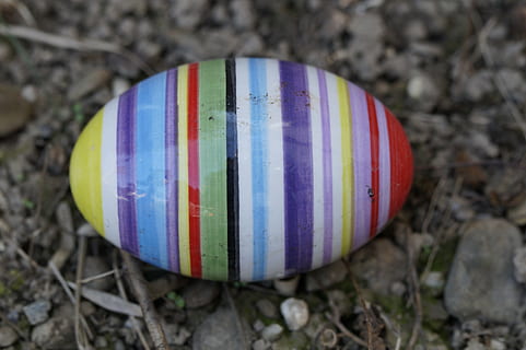 easter egg, ceramic, egg, colorful, striped, lost, easter bunny, easter, shiny, multi colored, close-up, no people, focus on foreground, day, single object, outdoors, land, nature, paint, solid, celebration, plant, field, food and drink, rock, 5K, CC0, public domain, royalty free