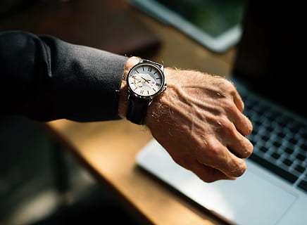 person, wearing, round silver-colored, white, analog, watch, people, man, hand, wrist, time, business, office, human hand, wristwatch, one person, human body part, men, indoors, adult, working, clock, business person, businessman, close-up, technology, accuracy, selective focus, checking the time, finger, human limb, 5K