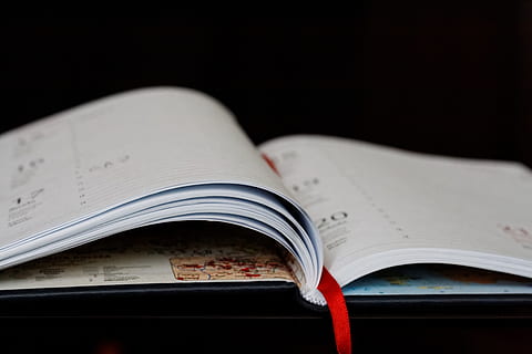 calendar, paper, diary, page, planner, publication, book, education, open, indoors, black background, studio shot, close-up, no people, still life, copy space, wisdom, selective focus, learning, expertise, document, literature, textbook, 4K