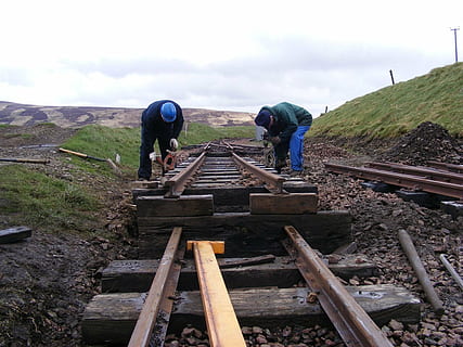railways, tracks, greenery, rails, rain, wet, railroad Track, people, sky, real people, wood - material, men, working, day, transportation, nature, group of people, cloud - sky, bending, lifestyles, occupation, full length, adult, mountain, outdoors, track, 720P, CC0, public domain, royalty free
