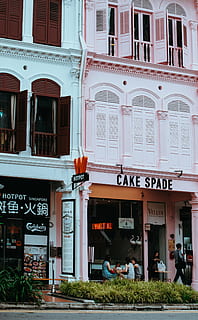 cake spade, concrete, building, beside, blue, architecture, infrastructure, shop, store, people, girls, eating, cafe, restaurant, green, grass, text, building exterior, built structure, outdoors, communication, travel destinations, day, city, no people, western script, window, real people, entrance, men, group of people, business, door, 4K, CC0, public domain, royalty free