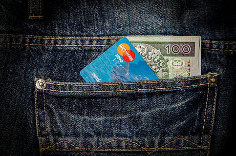 closeup, photo, 100 banknote, mastercard debit card, mastercard, credit, card, money, bills, notes, dollars, finance, cash, credit card, jeans, pocket, denim, indoors, no people, paper currency, studio shot, blue, close-up, black background, day, currency, wealth, still life, business, textile, bag, text, savings, metal, communication, clothing, packet, small group of objects, consumerism, 4K, CC0, public domain, royalty free