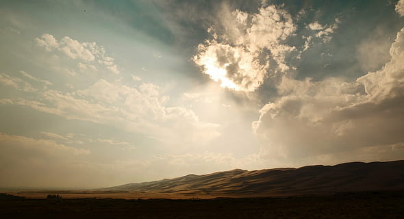 brown, mountain, daytime, sky, clouds, sunlight, sunrays, sunny, desert, sand, hills, scenics, beauty in nature, cloud - sky, nature, landscape, tranquility, tranquil scene, idyllic, no people, environment, scenics - nature, dramatic sky, land, horizon, awe, cloudscape, travel, horizon over land, sunset, sun, outdoors, semi-arid, bright, climate, 720P, CC0, public domain, royalty free