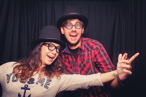 man, woman, wearing, black, hat, magic, geek, fun, nerd, colorful, play, faces, two people, happiness, emotion, glasses, young adult, portrait, smiling, adult, eyeglasses, young men, cheerful, young women, men, positive emotion, clothing, enjoyment, people, looking at camera, couple - relationship, mouth open, excitement, nightlife, 2K, CC0, public domain, royalty free