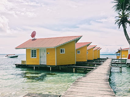 photo, brown, houses, sea, day time, day, time, beach, vacations, water, nature, wood - Material, island, summer, coastline, tropical Climate, outdoors, travel Destinations, house, blue, pier, no People, sky, idyllic, jetty, travel Locations, bungalow, hut, scenics, built structure, architecture, building exterior, building, cloud - sky, residential district, waterfront, tree, transportation, nautical vessel, 2K, CC0, public domain, royalty free