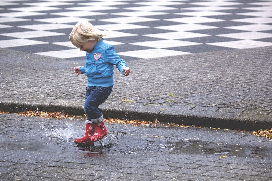 boy, blue, jacket, hopping, water puddle, child, jump, jumping, puddle, rain, splash, splashing, water, young, childhood, full length, one person, real people, boys, casual clothing, day, leisure activity, lifestyles, innocence, males, city, men, road, females, nature, outdoors, 5K